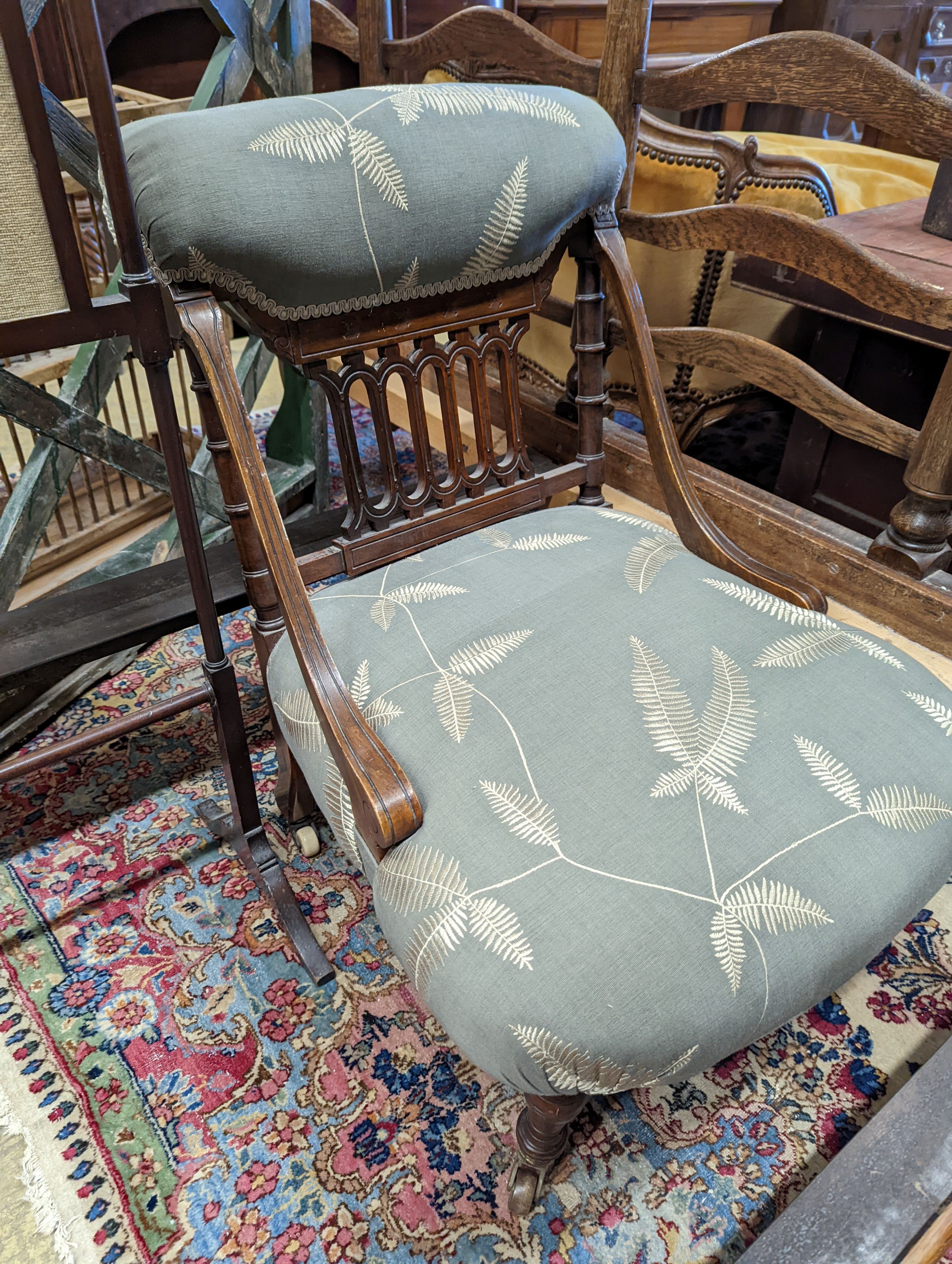 A Victorian upholstered nursing chair, together with a later fire screen